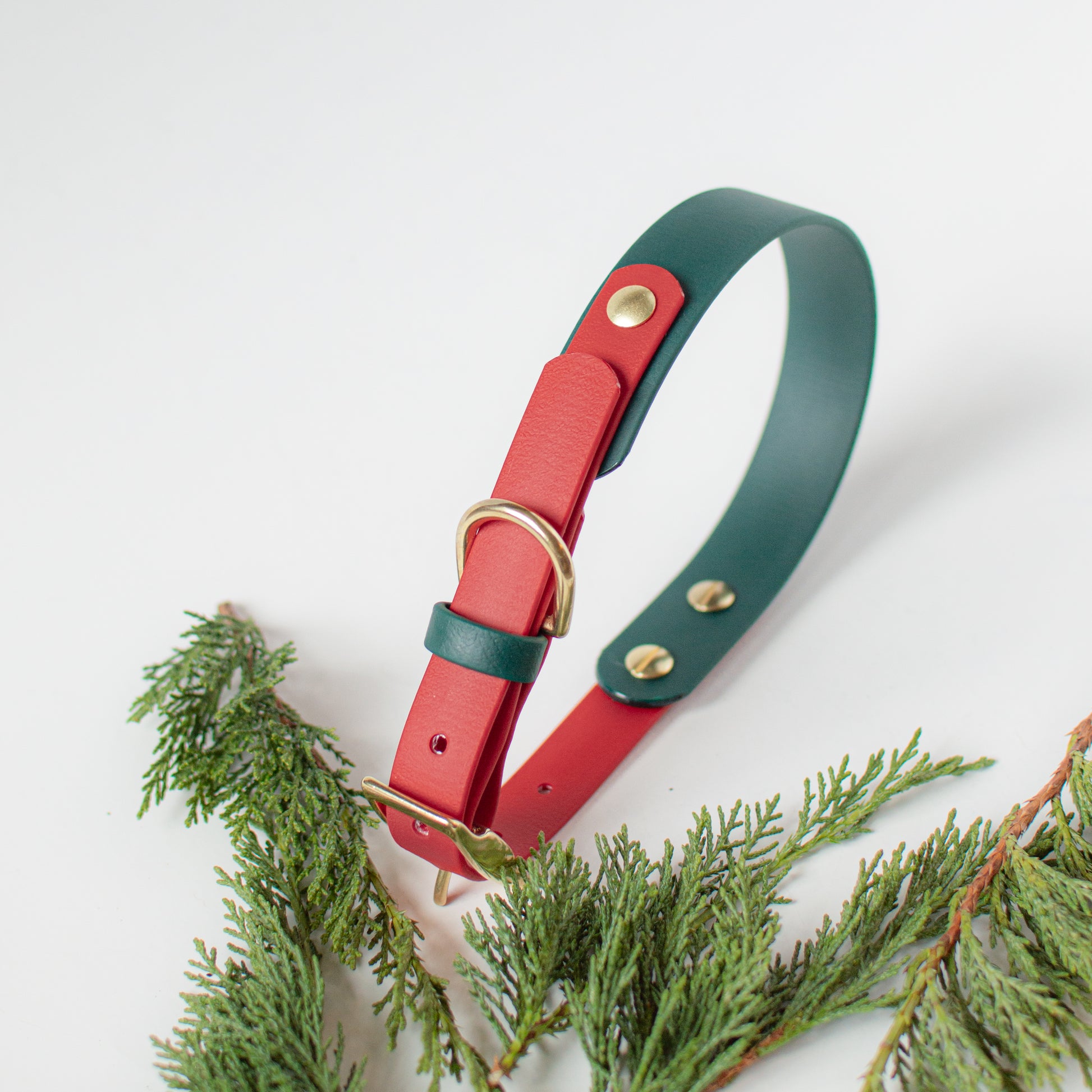 Wanderlust Pup Co. Biothane dog collar christmas bow in green. Handmade in British Columbia, Canada